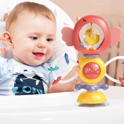 Bébé 6 mois jouant avec spinner ventouse chaise haute — éveil sensoriel Sphère Bébé"