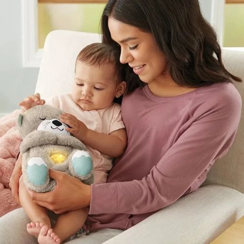 doudou-loutre-peluche-loutre lumineuse-musicale-pour-développer-l'éveil-sensorielle-de-votre-bébé